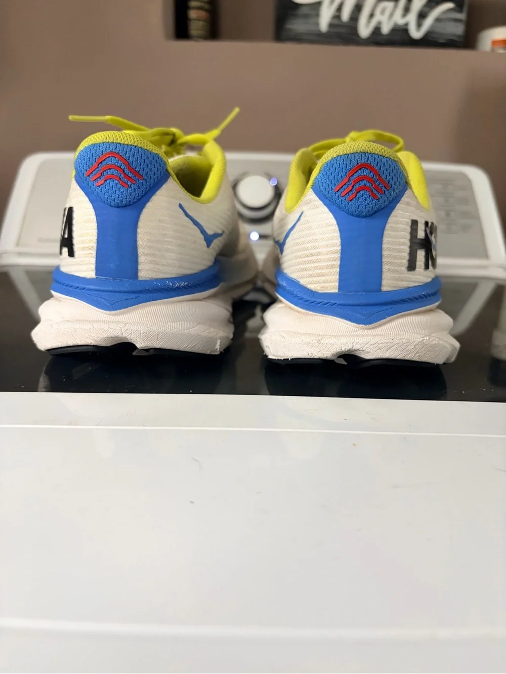 Hoka Yellow and White Running Shoes with Blue Logo Accent
